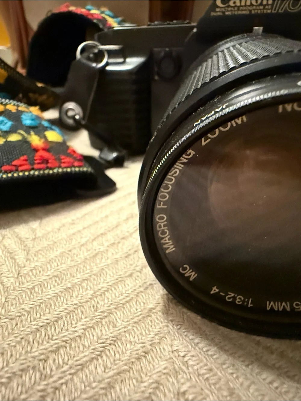 Canon T-70 35mm film camera with 35mm-105mm Zoom Lens with Multicolor Strap